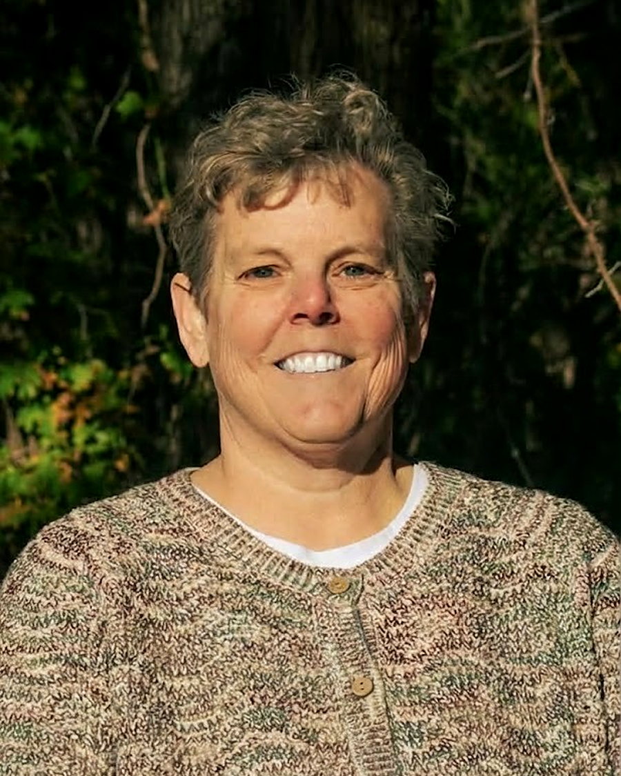 Jennifer D. Ashford, smiling outdoors.